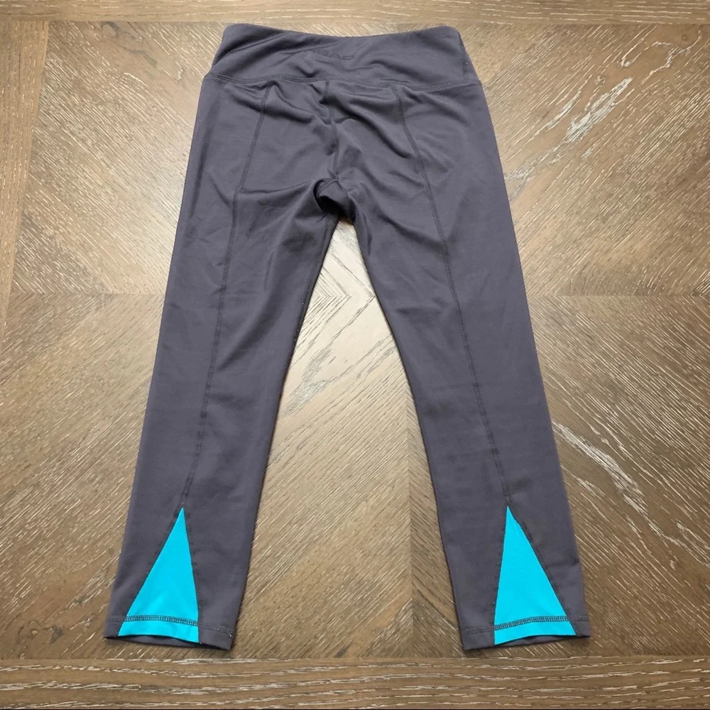 Head gray athletic pants turquoise on back legs Size XS